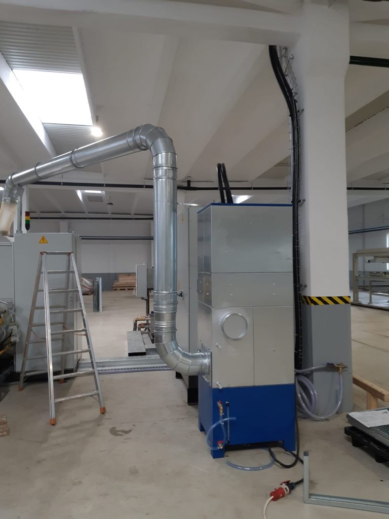 ALWO oil mist collector connected to a machine by ductwork
