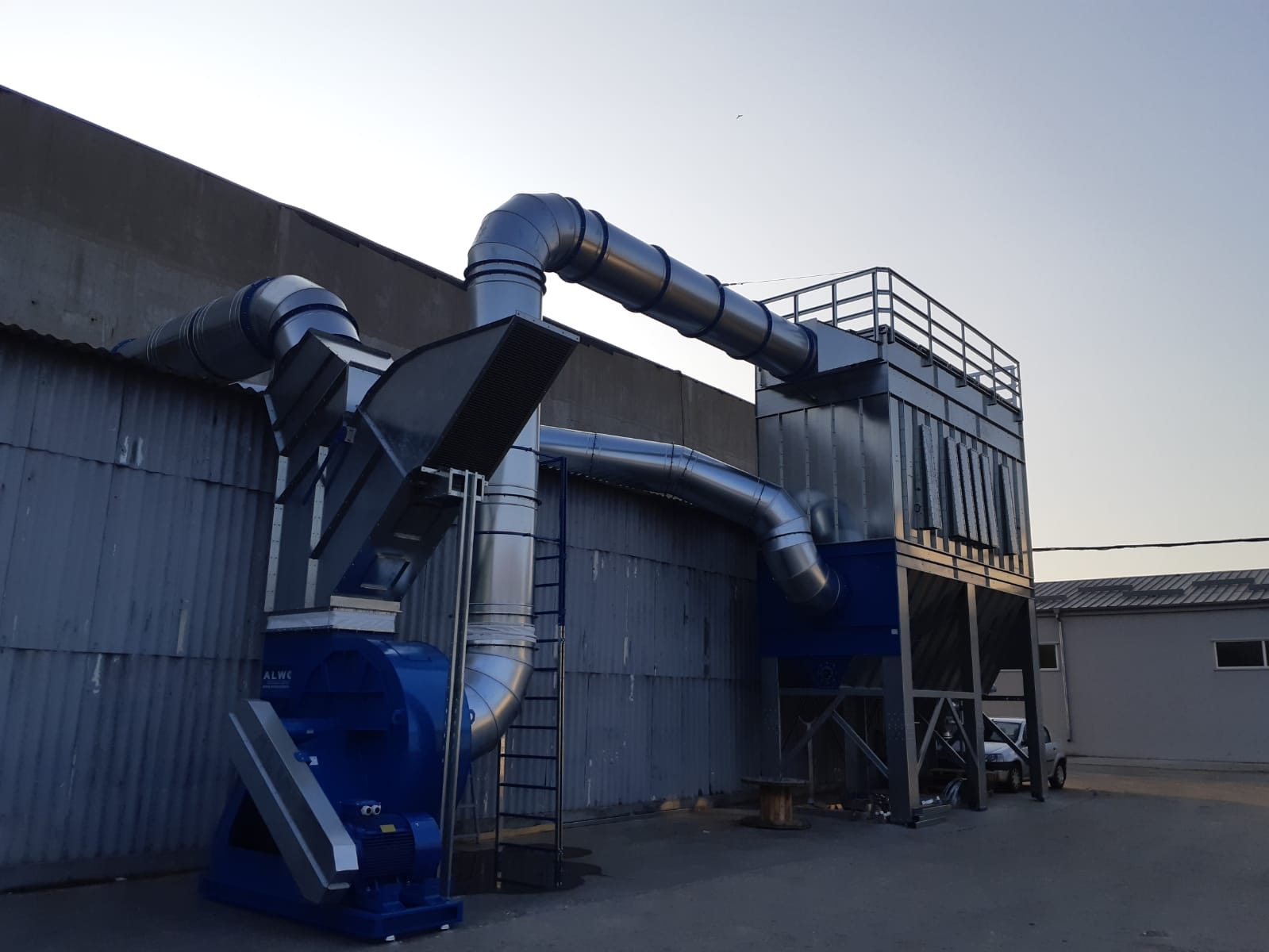 Compact ALWO SFPJ baghouse with industrial fan and ductwork