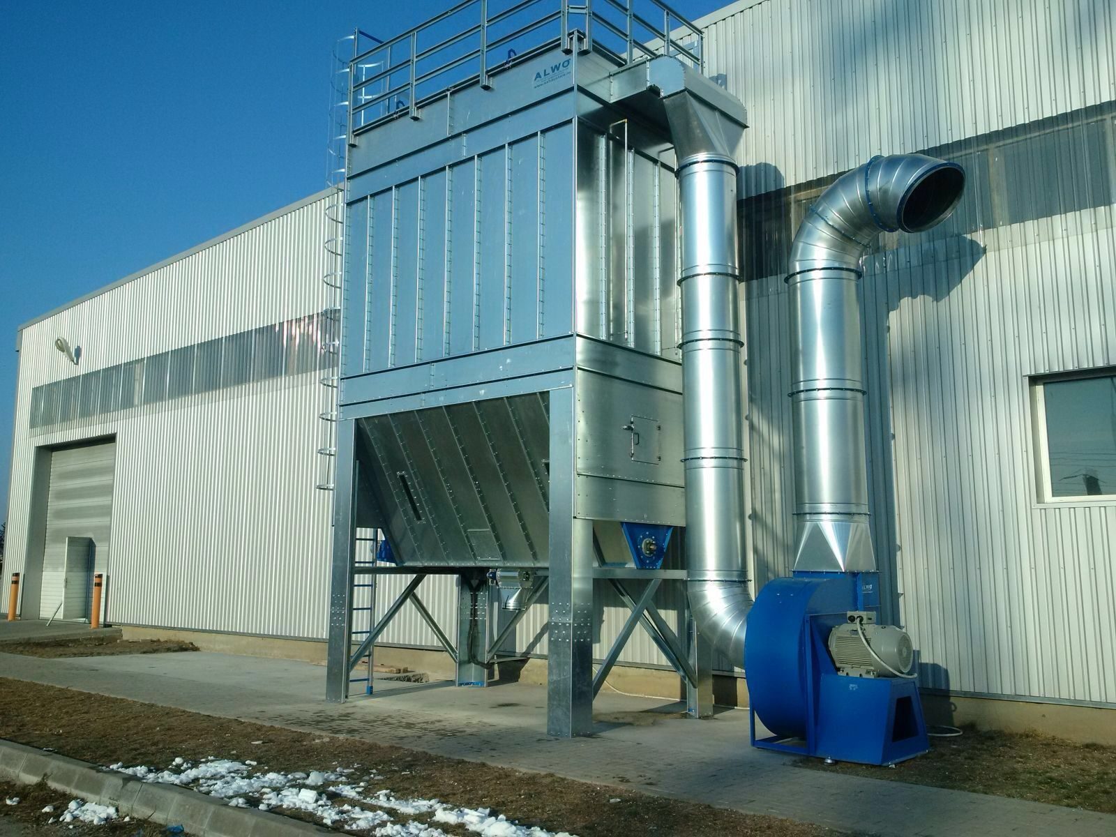 ALWO SFPJ centralised baghouse installed outside a factory